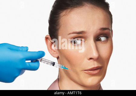 Donna ottenere iniezione di Botox Foto Stock
