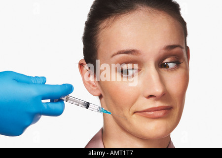 Donna ottenere iniezione di Botox Foto Stock