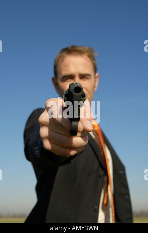 Uomo con arma Foto Stock