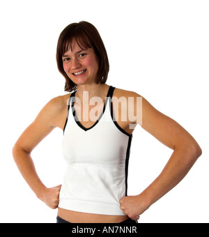 Giovane donna sorridente durante gli esercizi di fitness Foto Stock