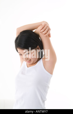 Giovane donna stretching Foto Stock