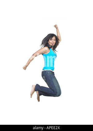 South Asian donna indiana jumping con gioia il signor Foto Stock