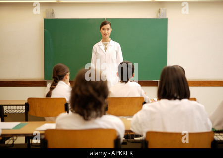 Studenti e insegnante in classe Foto Stock