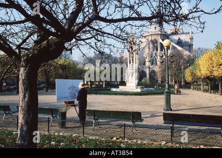 Pittore fare uno schizzo della luce invernale sulla Cattedrale di Notre Dame Ile de France Parigi Francia Foto Stock