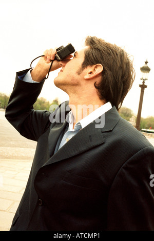 L'uomo prendendo fotografie, Place de la Concorde, Paris, Francia Foto Stock