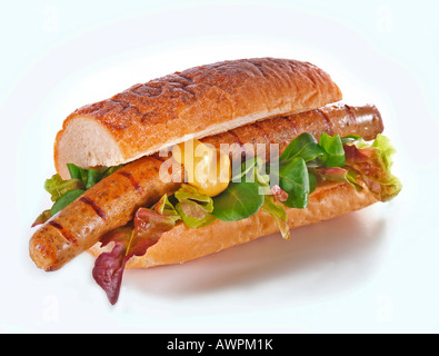 Veggie (tofu) bratwurst, la senape e la lattuga su una baguette Foto Stock