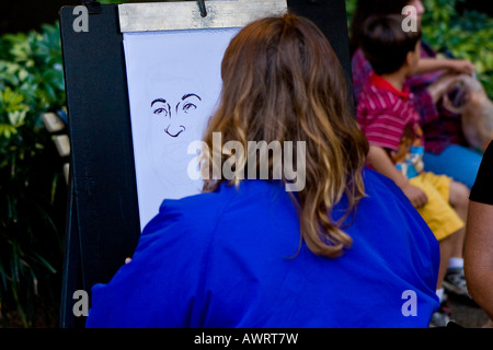 La caricatura artista abbozzare un volto Foto Stock