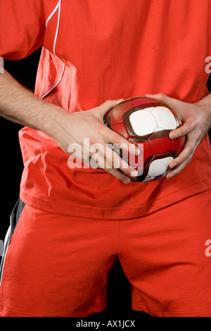 Un uomo giocando a pallamano Foto Stock