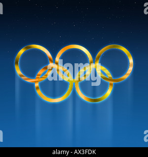 Golden anelli olimpici contro blu profondo sfondo graduate Foto Stock