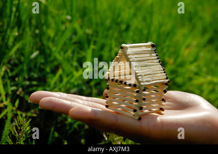 Casa da partite in una mano Foto Stock