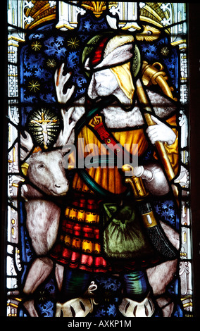 Vetrata dei Kempe Studios installato 1891; Saint Hubert Patron Saint dei Cacciatori, St Leonard's Church, Charlecote, Warwickshire Foto Stock