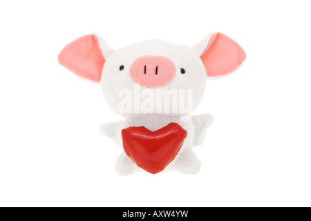 Salvadanaio di peluche con cuore rosso su sfondo bianco Foto Stock