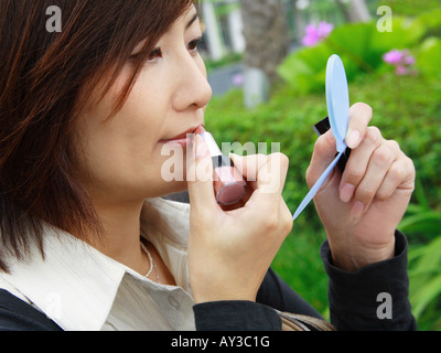 Profilo laterale di una imprenditrice rossetto Foto Stock
