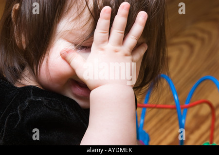 Nove mesi ragazza bambino piangere Foto Stock