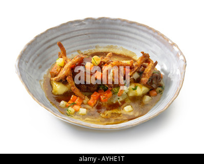 Brasato di suini testa con zampone e confit di rapa Foto Stock