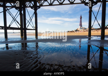 Under Central Pier Blackpool with Blackpool Tower and North Pier in the distance Foto Stock