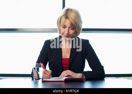 Imprenditrice rendendo note Foto Stock