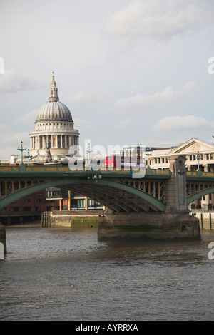 Red double decker bus crossing Blackfriars bridge London Foto Stock