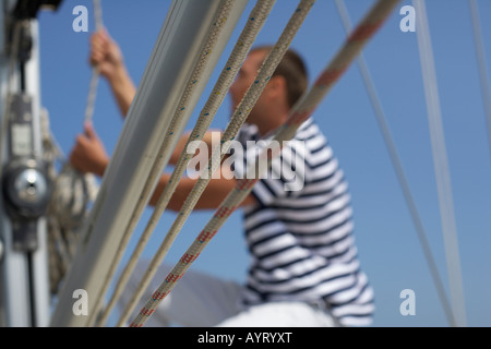 Corde stretto, persona in background Foto Stock