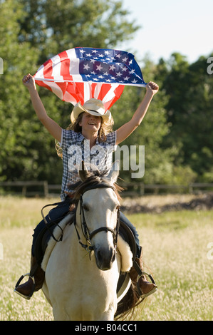 Una ragazza con la bandiera americana Foto Stock