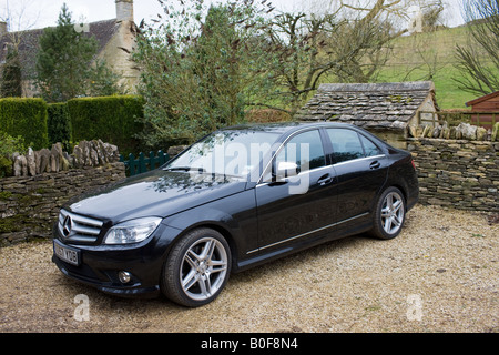 Mercedes nero C350 Sport berlina Cotswolds Oxfordshire, Regno Unito Foto Stock