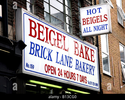 Segno su 24 ore negozio di Beigel in Brick Lane London Foto Stock