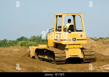 Macchine per il movimento terra a lavorare su un sito consturction Foto Stock