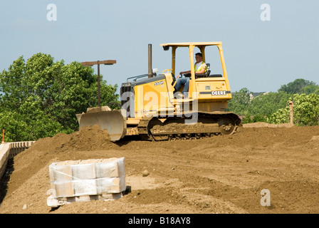 Macchine per il movimento terra a lavorare su un sito consturction Foto Stock