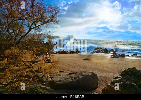 Luce di tempesta sulla spiaggia Foto Stock