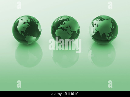 Tre globi verde Foto Stock