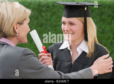 Congratulazioni madre figlia laureati Foto Stock