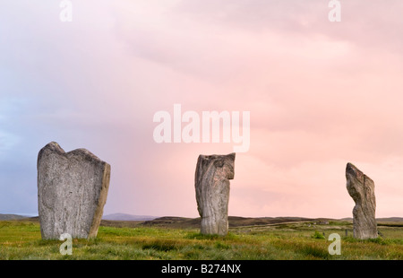 Callanish pietre permanente all'alba, isola di Lewis, Ebridi, Scotland, Regno Unito Foto Stock