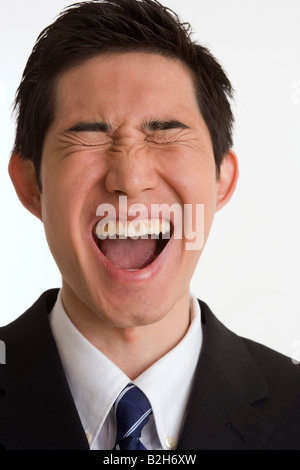 Close-up di un imprenditore urlando Foto Stock
