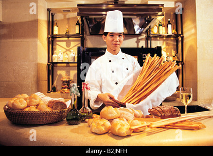 Lo chef cinese la cottura del pane nella cucina dell'hotel. Grand Hyatt. Hong Kong. Foto Stock