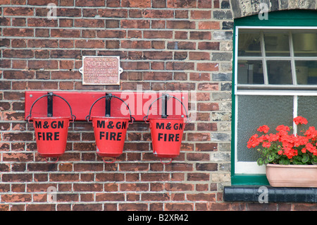 Fire benne Sheringham stazione sulla North Norfolk Steam Railway, Norfolk, Inghilterra. Foto Stock