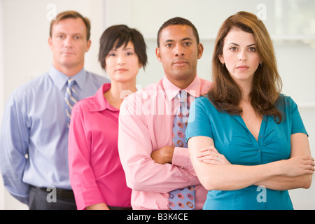 Business team standing indoors Foto Stock