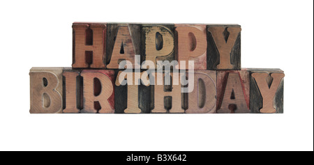 Le parole "happy birthday" nella vecchia, inchiostro colorato tipo di legno Foto Stock