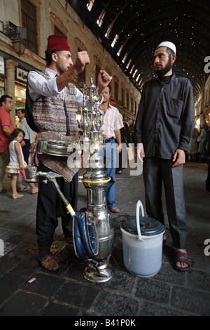 Acqua tradizionale venditore in Damasco, Siria Foto Stock