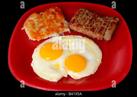 La prima colazione tradizionale di uova e salsiccia hash brown patate Foto Stock