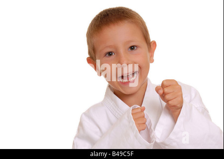 Bambino nel karate unifrom praticanti di arti marziali Foto Stock