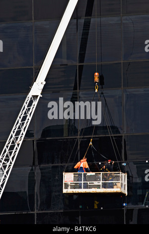 Costruzione / Costruzione dei lavoratori durante il lavoro su un edificio.Melbourne Victoria Australia. Foto Stock