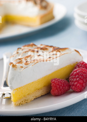 Fettina di limone Crostata con lamponi Foto Stock