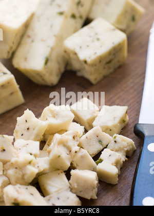 Pezzi di formaggio paneer con spezie Foto Stock