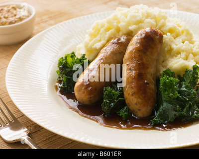 Salsicce di maiale e Mash con cavolo riccio Foto Stock
