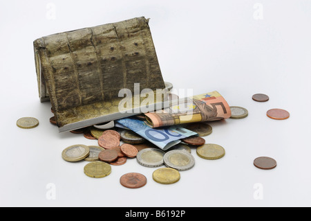 Vecchia borsa capovolto, banconote e monete che cadono, controllo di cassa Foto Stock