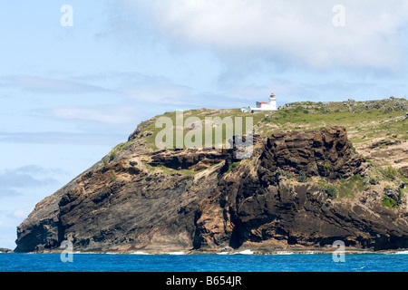 Faro di scogliere ripide e operazioni automatiche di fine campo, l'Isola di Coin de Mire riserva naturale, Mauritius. Foto Stock