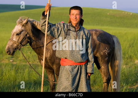 Praterie pastore a cavallo le catture a cavallo con corda e pole urga Xilinhot Inner Mongolia Cina Foto Stock