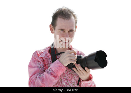 Ritratto di un bel giovane fotografo sulla spiaggia Foto Stock