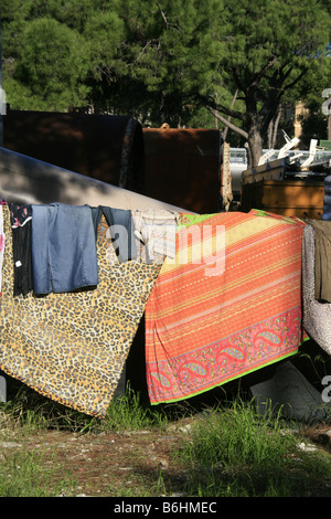 Di immigrati e di lavaggio biancheria stesa ad asciugare in Roma Foto Stock