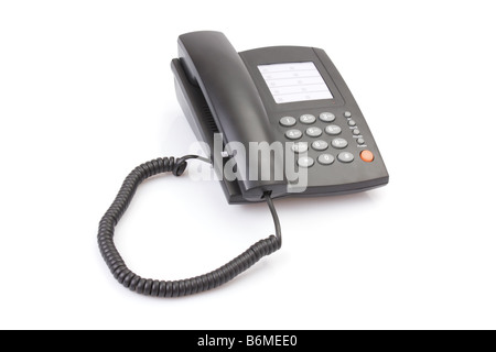 Telefono ufficio con cavo sinuose isolato su bianco. Foto Stock